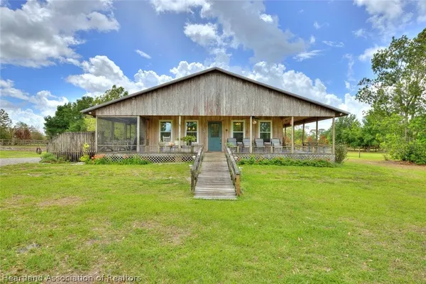 a front view of house with patio and garden