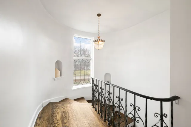 a view of a hallway with windows