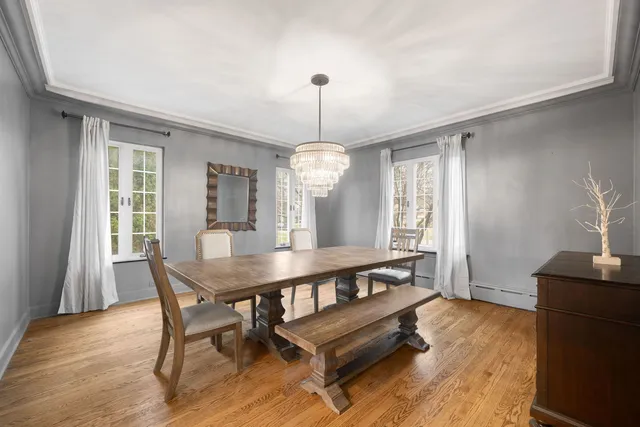 a view of a dining room with furniture window and wooden floor