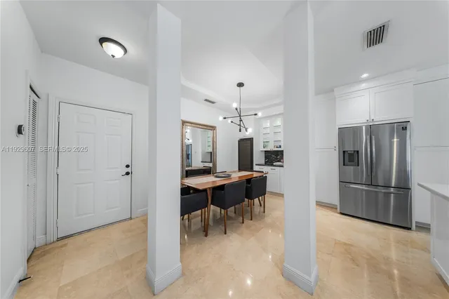 a view of a kitchen and dining room
