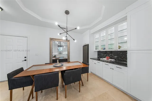 a kitchen with a table and chairs in it