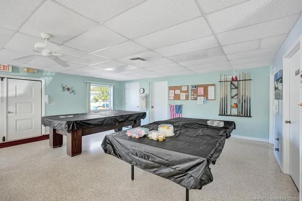 a white refrigerator freezer sitting inside of a kitchen