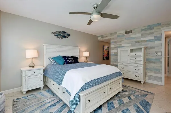 a bedroom with a bed and a dresser