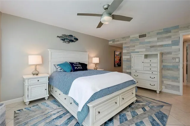 a bedroom with a bed and a dresser
