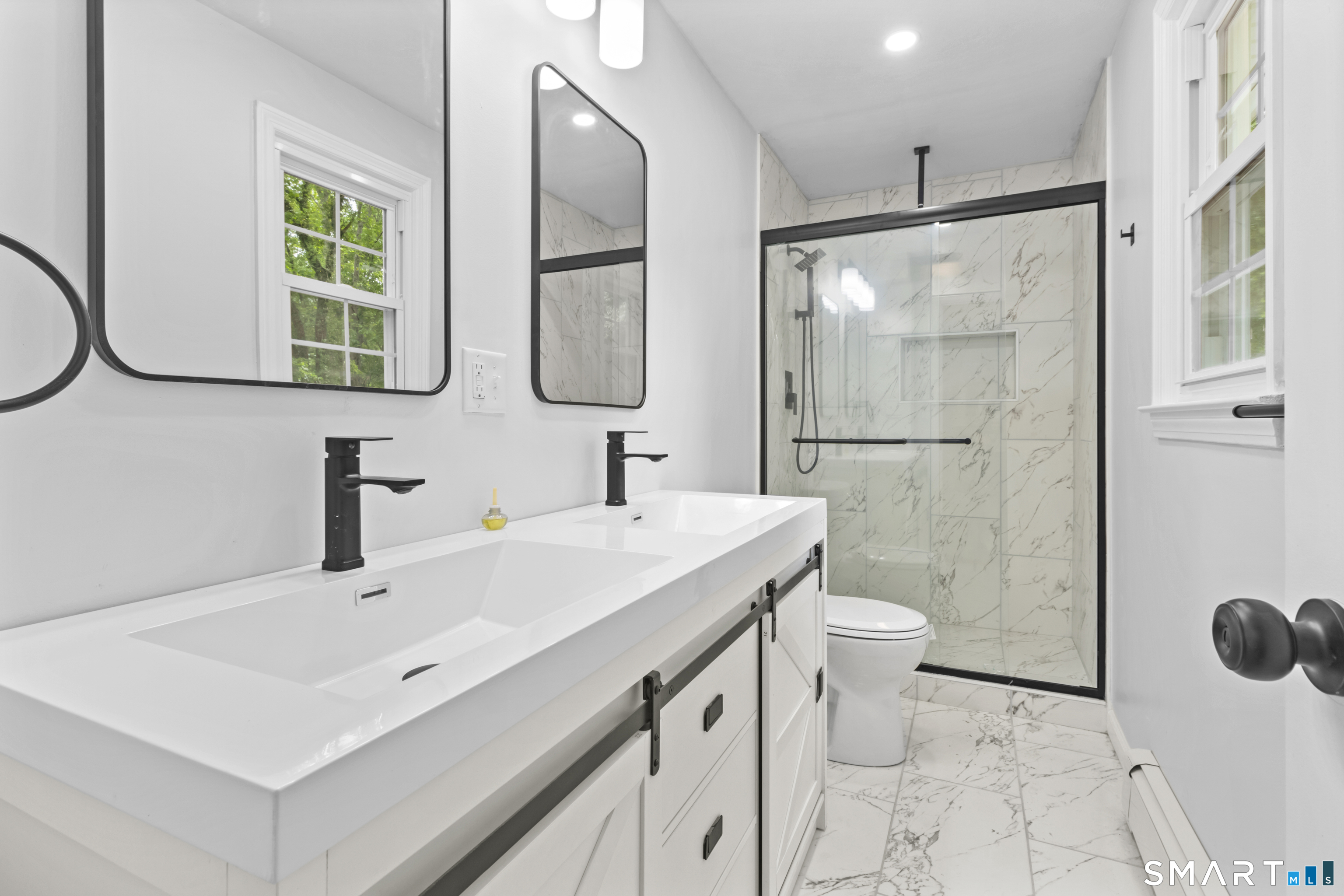 20 Quiet Woods Road East Hampton, CT 06424 - Photo 14 of 40 a bathroom with a sink a toilet and a mirror