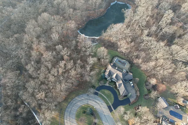 a aerial view of house with yard