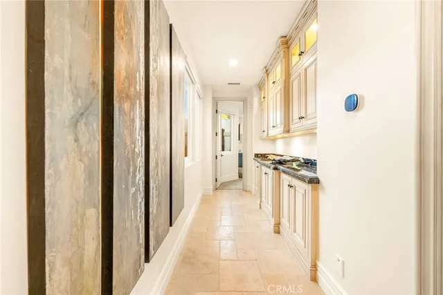 a view of an empty room with a fireplace