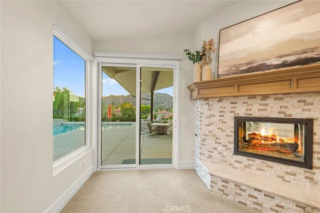 a view of a backyard with swimming pool