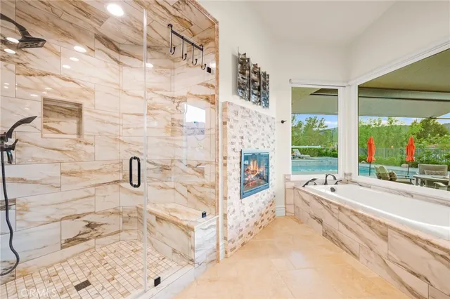 an aerial view of a house a yard and outdoor seating