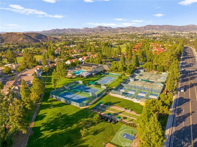a dining table chairs sitting in a kitchen next to a window