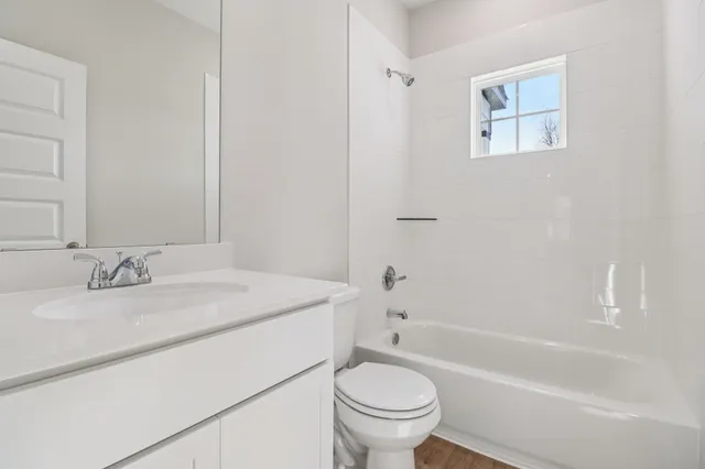 a bathroom with a sink toilet and bathtub