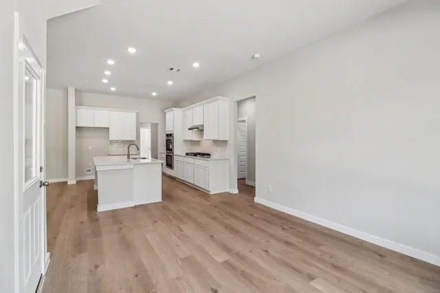 a view of kitchen with wooden floor