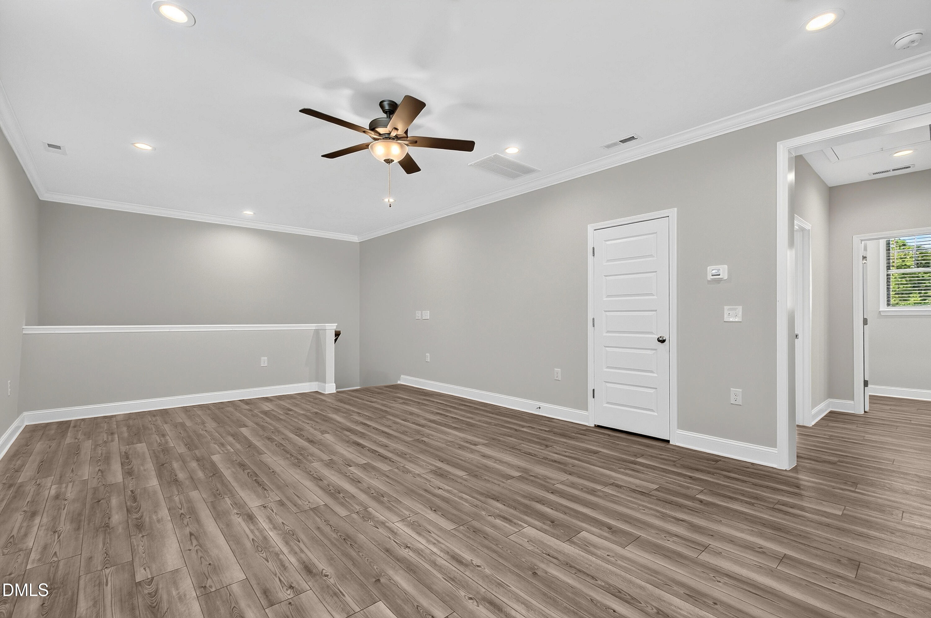 1300 Commons Ford Place Apex, NC 27539 - Photo 46 of 70 a view of an empty room and wooden floor