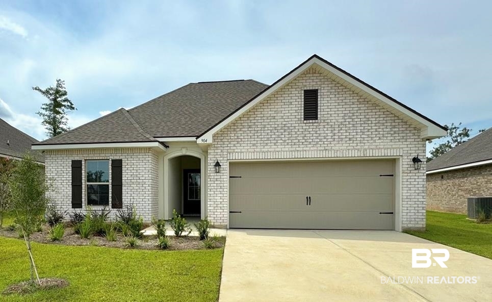 904 Sumter Loop Foley, AL 36535 - Photo 1 of 10 View of front of property with a garage and a front yard