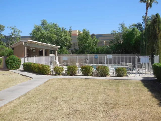 a view of a chair and table in the patio