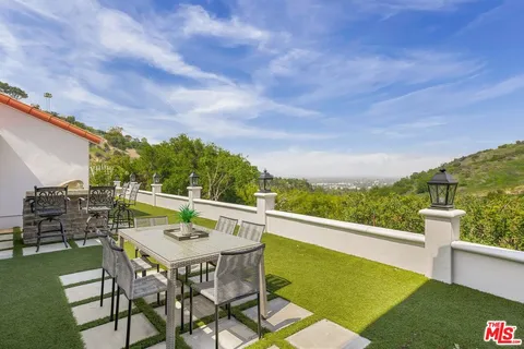 a view of a chairs and table on the terrace