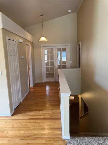 a view of a livingroom with furniture wooden floor and window