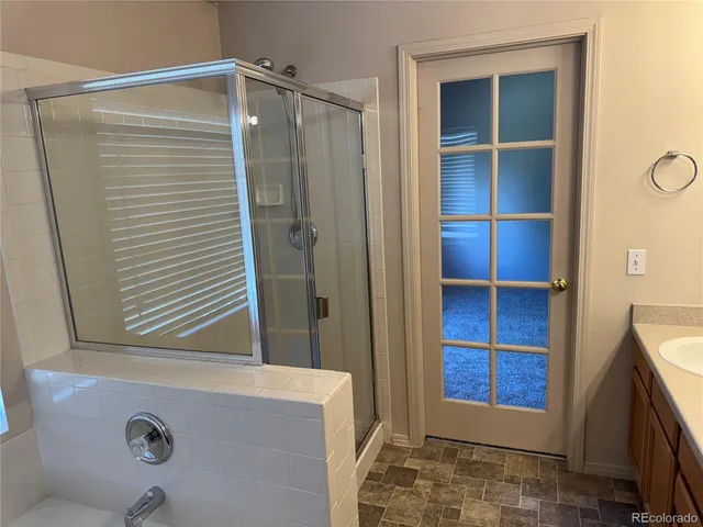 a bathroom with a tub and a window