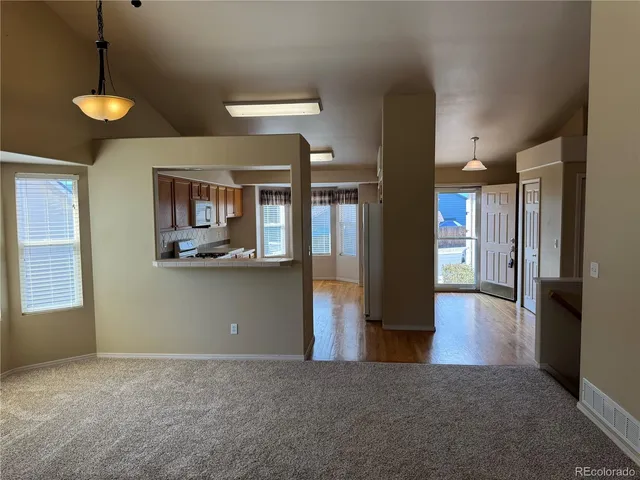 a view of a living room with a fireplace