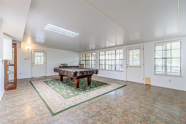 a living room with furniture and a rug