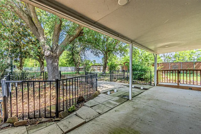 a view of porch with wooden floor