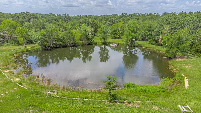a view of a lake with a yard