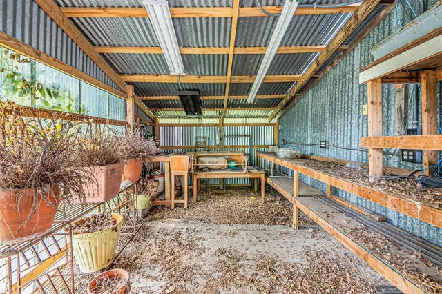 a view of a backyard with sitting area