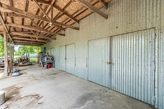 a view of a garage with an outdoor space