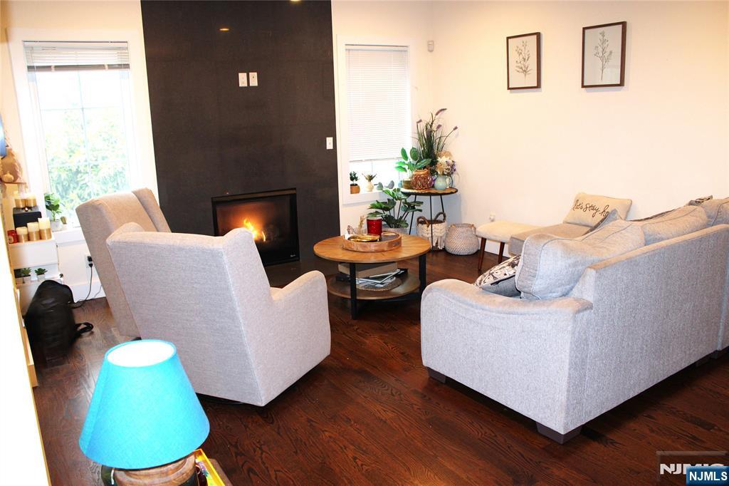 294-296 Tenafly Road Tenafly, NJ 07670 - Photo 3 of 24 a living room with furniture and a fireplace