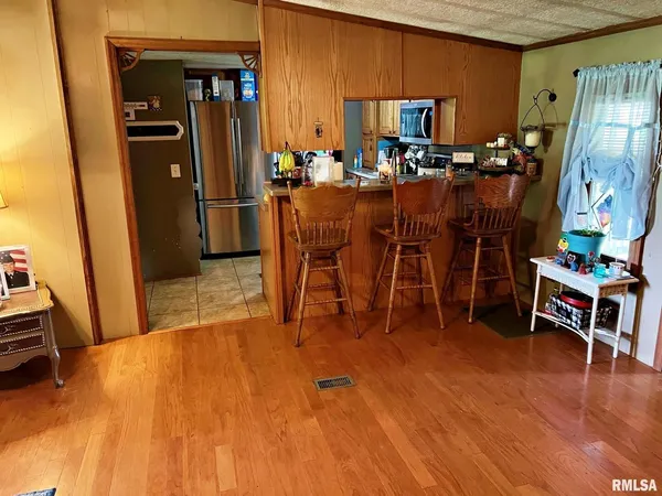a bedroom with a bed and a table in it