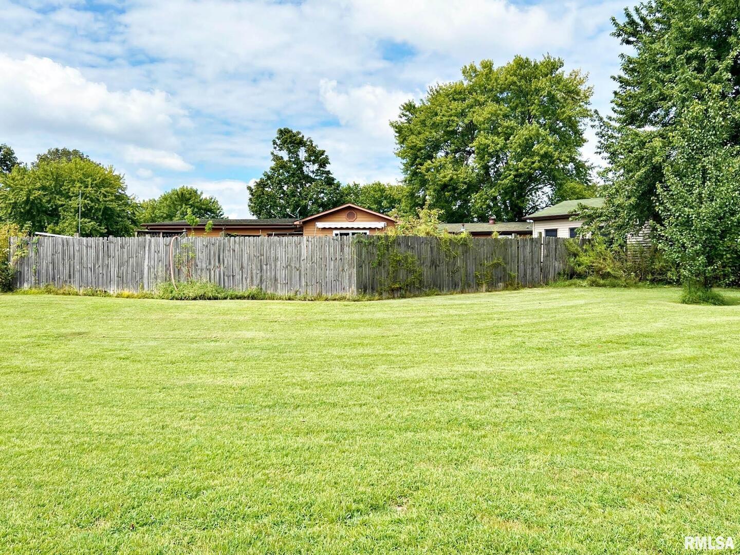 2516 Strawberry Road Metropolis, IL 62960 - Photo 20 of 25 a view of a swimming pool with a big yard