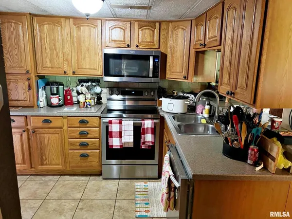 a kitchen with a stove and cabinets