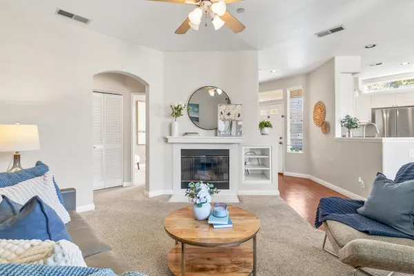 a living room with furniture and a fireplace