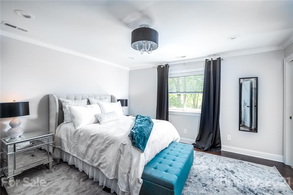 19007 Kailua Circle Tega Cay, SC 29708 - Photo 12 of 45 a bedroom with a bed and a window