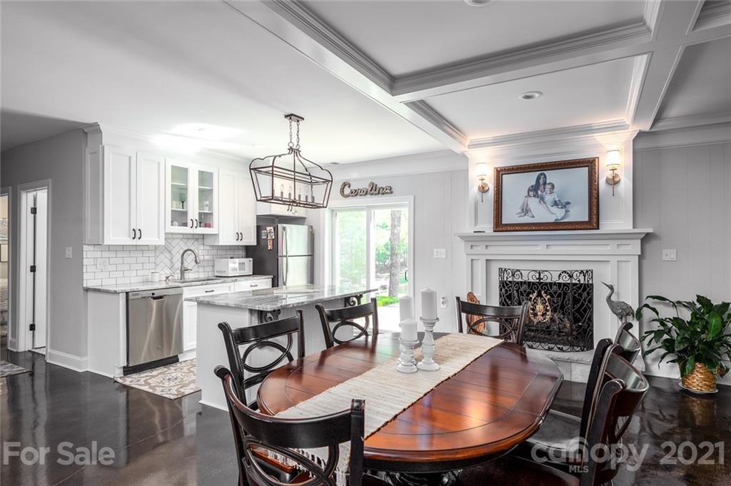 19007 Kailua Circle Tega Cay, SC 29708 - Photo 16 of 45 a dining room with furniture window and wooden floor