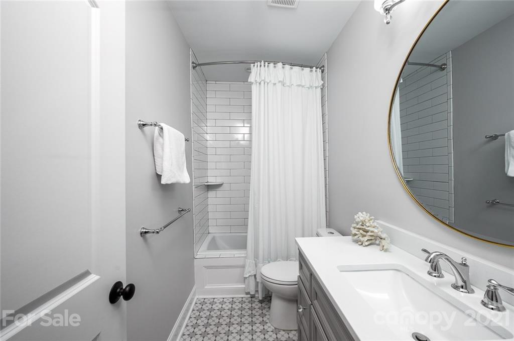 19007 Kailua Circle Tega Cay, SC 29708 - Photo 19 of 45 a bathroom with a sink a toilet and shower