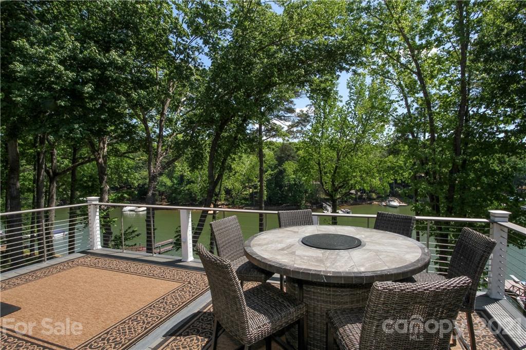 19007 Kailua Circle Tega Cay, SC 29708 - Photo 28 of 45 a view of a chairs and table on the deck