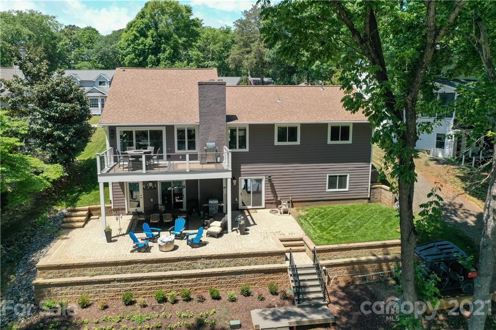 19007 Kailua Circle Tega Cay, SC 29708 - Photo 30 of 45 a view of a house with sitting area and garden