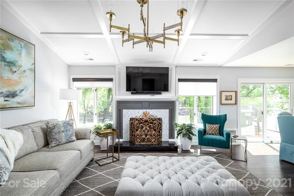 19007 Kailua Circle Tega Cay, SC 29708 - Photo 4 of 45 a living room with furniture a fireplace and a flat screen tv