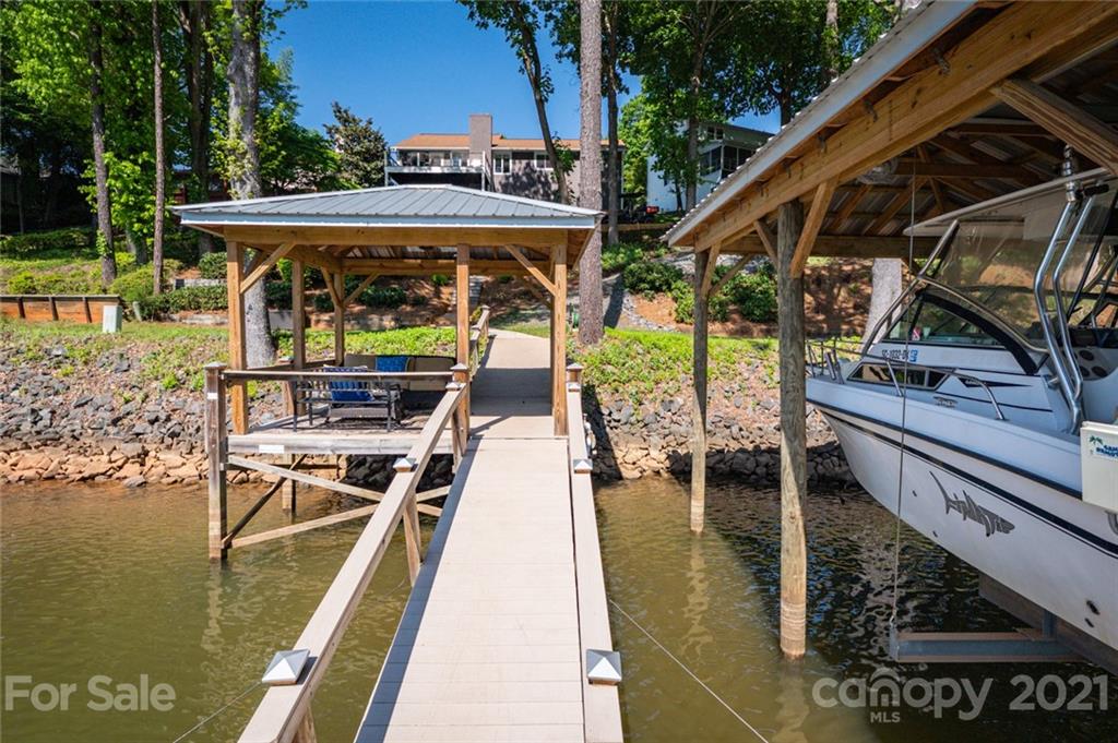 19007 Kailua Circle Tega Cay, SC 29708 - Photo 38 of 45 a view of balcony with two chairs and wooden floor