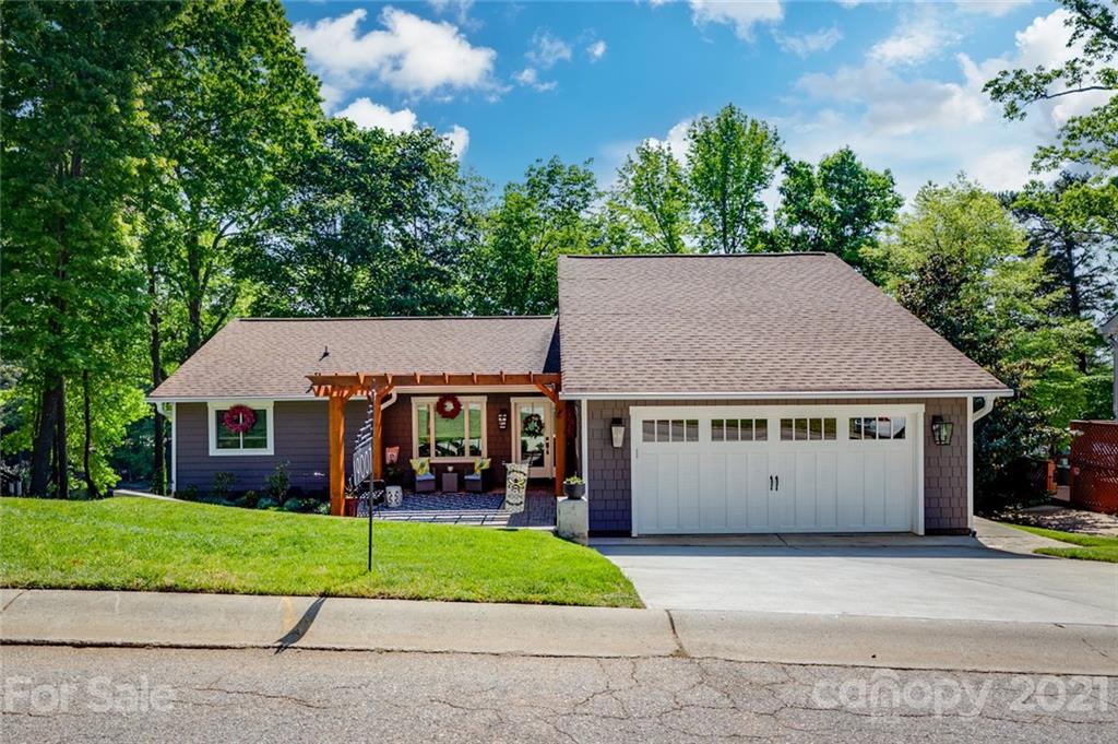 19007 Kailua Circle Tega Cay, SC 29708 - Photo 39 of 45 a view of house with garden and tall tress