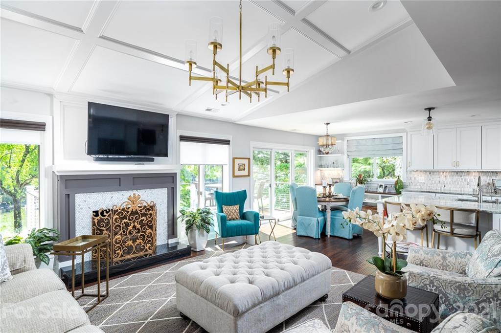 19007 Kailua Circle Tega Cay, SC 29708 - Photo 5 of 45 a living room with furniture a fireplace and a flat screen tv