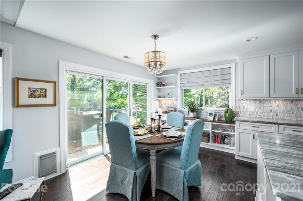 19007 Kailua Circle Tega Cay, SC 29708 - Photo 8 of 45 a dining room with furniture a chandelier and wooden floor