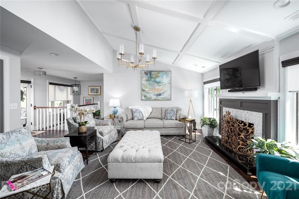 19007 Kailua Circle Tega Cay, SC 29708 - Photo 9 of 45 a living room with furniture a fireplace and a flat screen tv