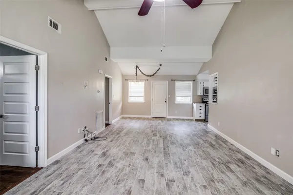 a view of a livingroom with wooden floor