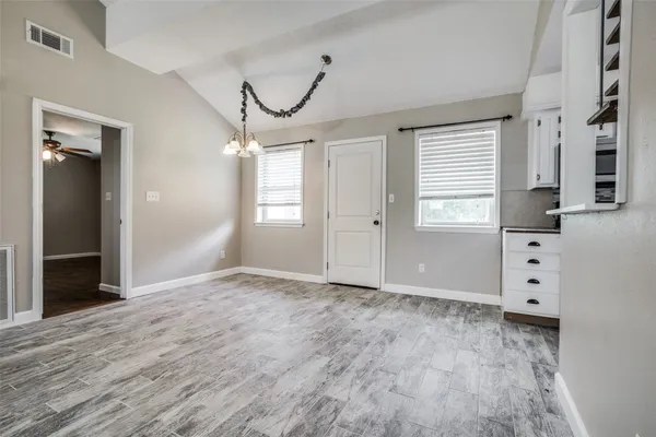 a view of an empty room with a window