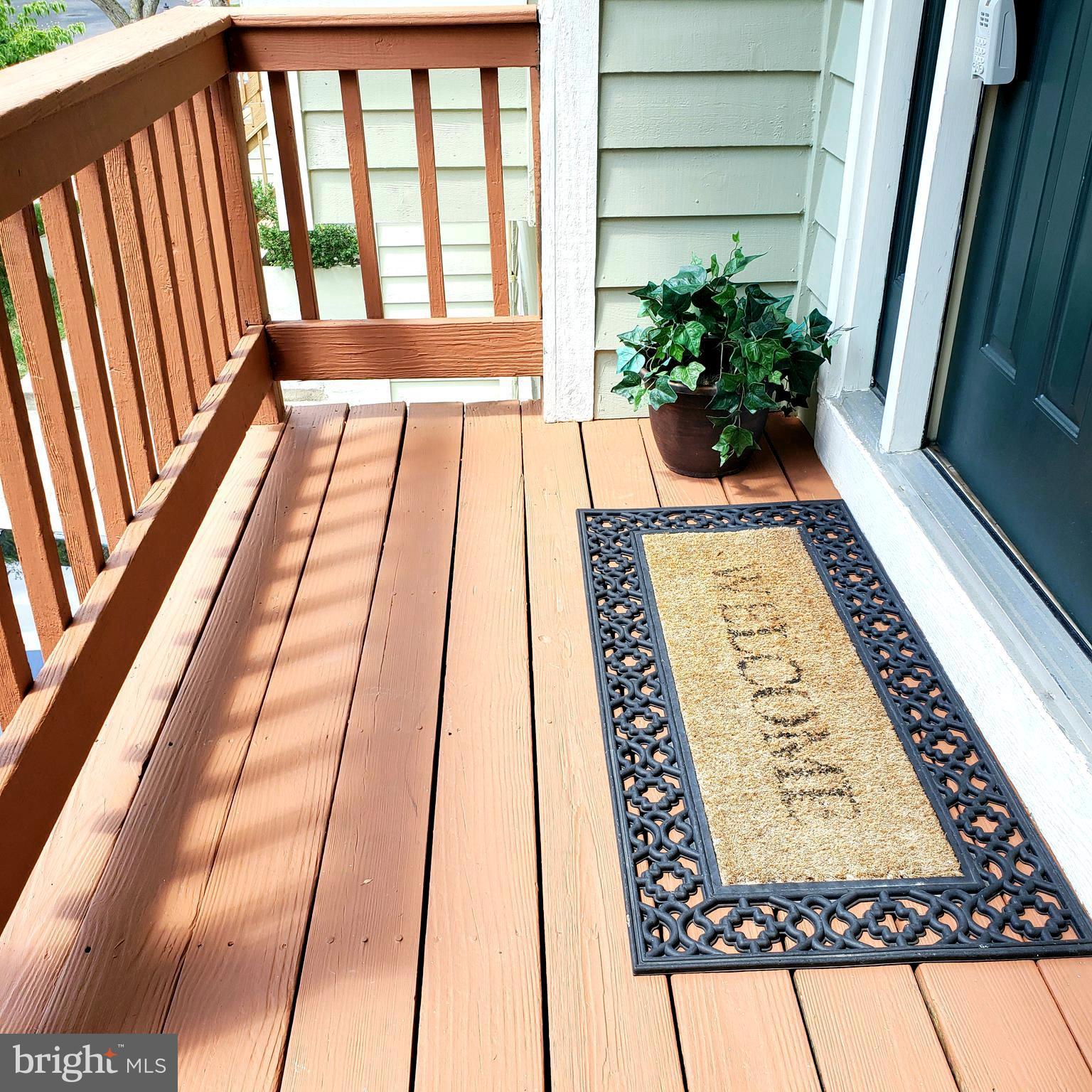 5263 Columbia Road, Unit 492 Columbia, MD 21044 - Photo 3 of 47 porch stained /new wood apprvd by HOA