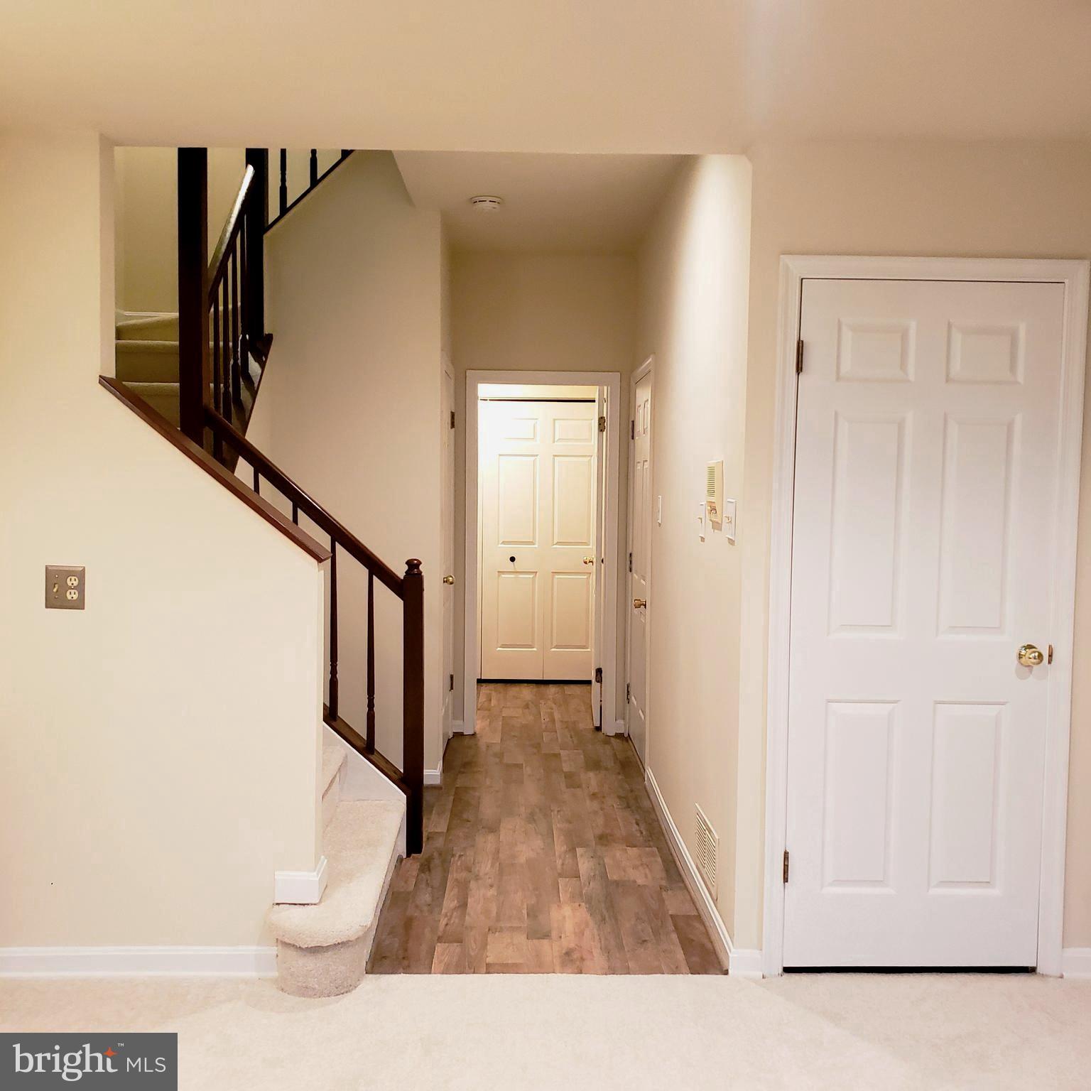 5263 Columbia Road, Unit 492 Columbia, MD 21044 - Photo 41 of 47 lower level hallway to garage and laundry room
