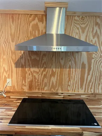 a view of a living room with wooden floor