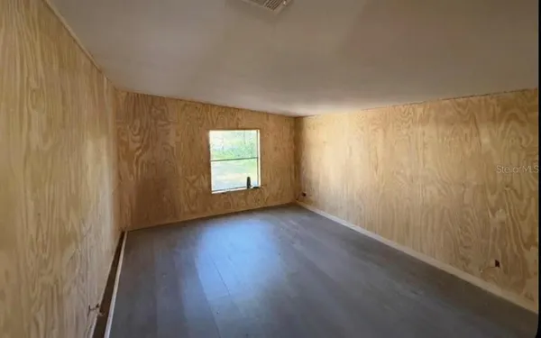 a view of kitchen with furniture and wooden floor